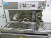 The enrobing machine LCM ATC-P 320 with booster pump.