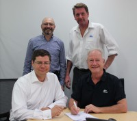Great potential: (front row) Mark Mueller (left), CEO, NID, Alf Taylor, CEO, tna; (back row) Edward Smagarinsky, COO, NID and Bob Fritz, Chief Business Development Officer, tna (right).